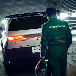 Photo image of a driver approaching the rear of an IONIQ 5 N DK Edition parked in a garage