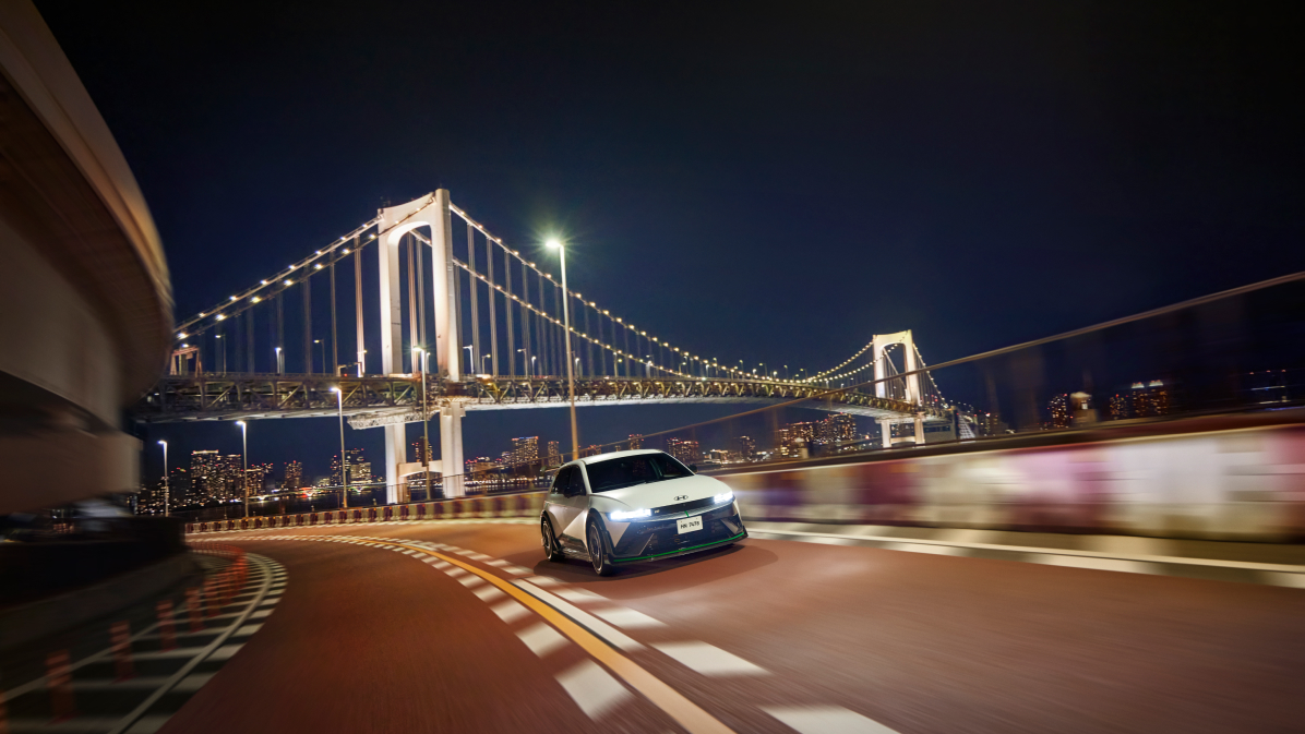 Photo image of a driver approaching the rear of an IONIQ 5 N DK Edition parked in a garage